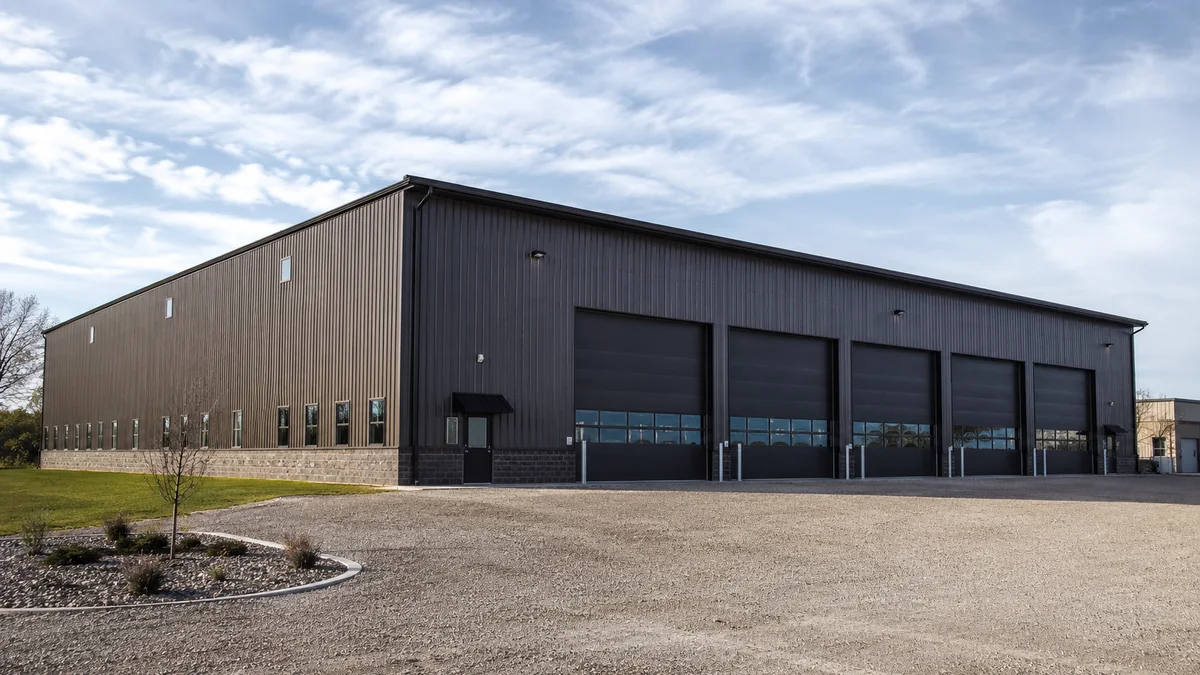 100x100 steel building and metal building exterior example for 100×100 Commercial Shop Layout