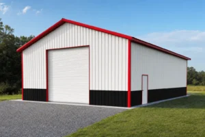 Completed 40x60 metal building with white panels, black wainscot, and red trim on a new concrete slab