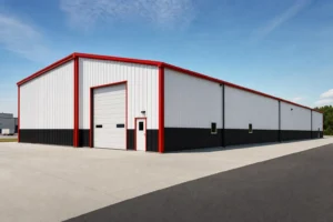 50x100 metal warehouse building viewed down its long sidewall in a small industrial park