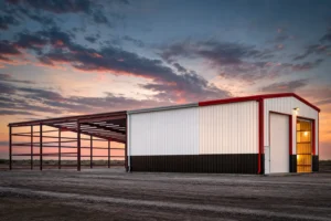 Steel building shown in three completion stages from bare frame to paneled shell to finished building